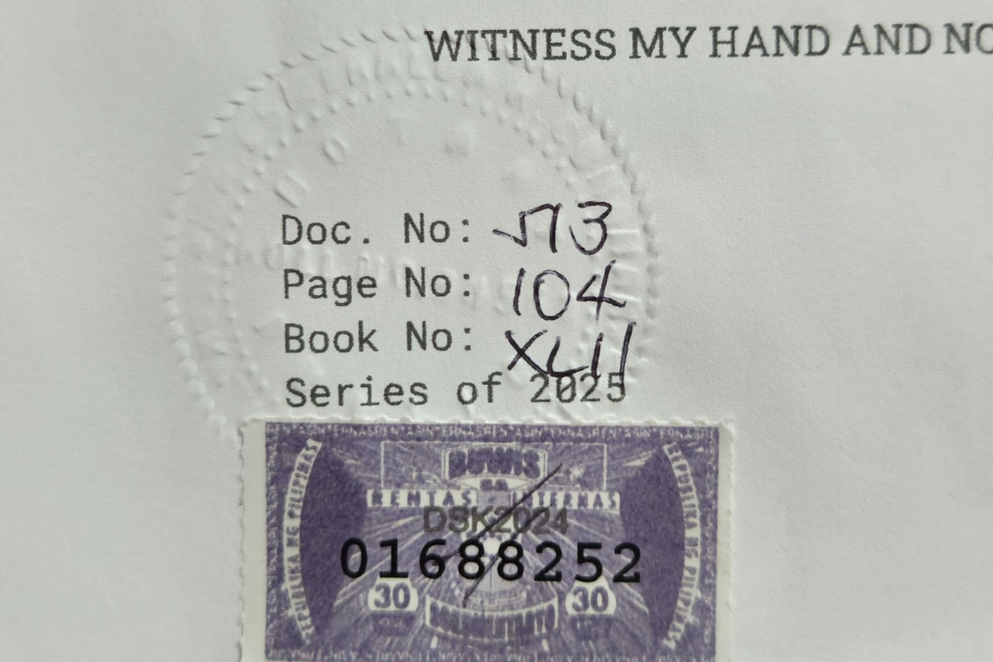 A notarised document with its embossed seal and register entry