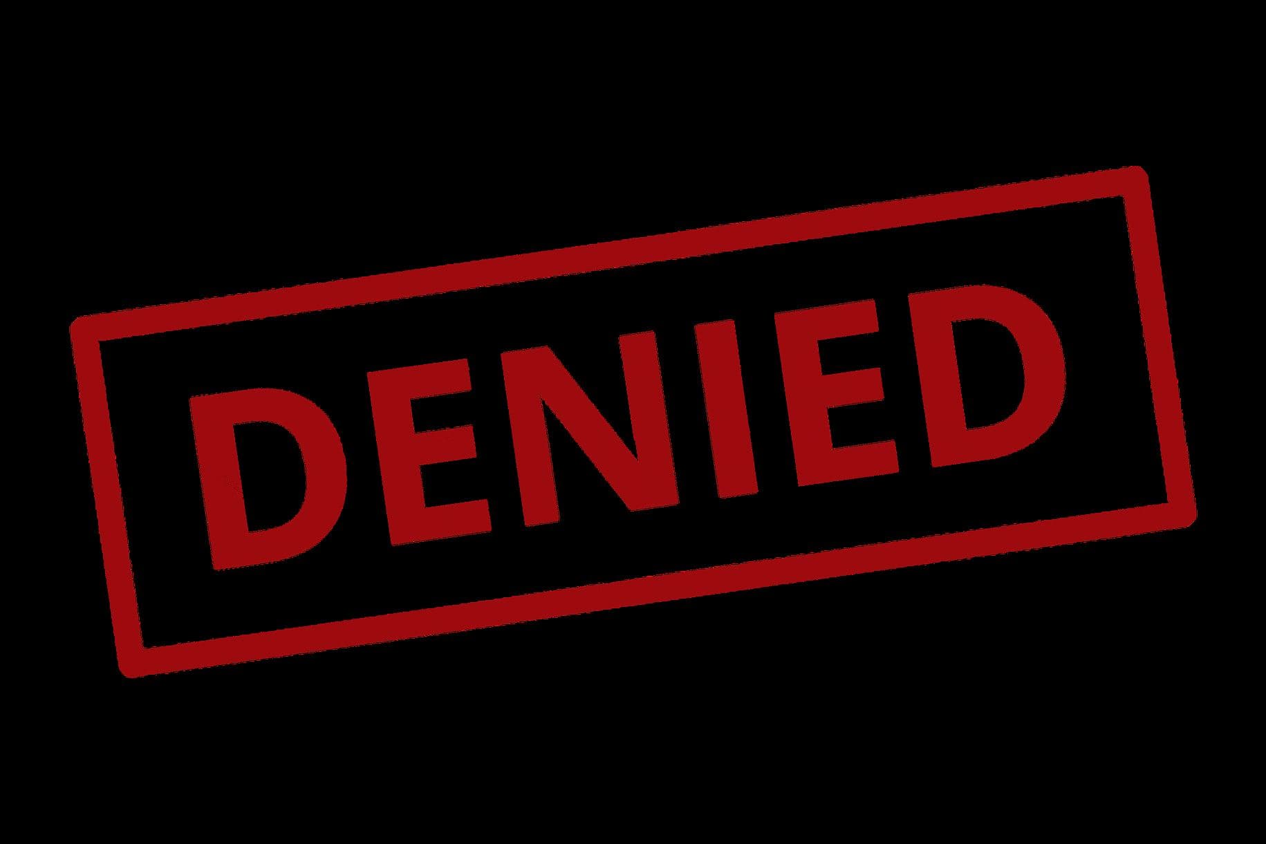 A red stamp reading “DENIED” on a black background